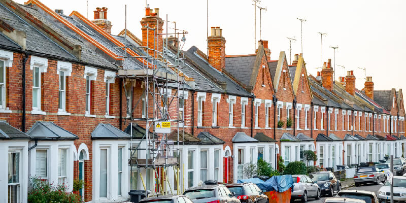 Scaffolding on house on street